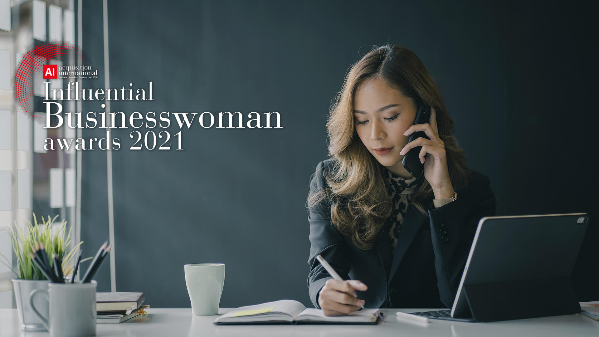 Businesswoman on the phone at her desk