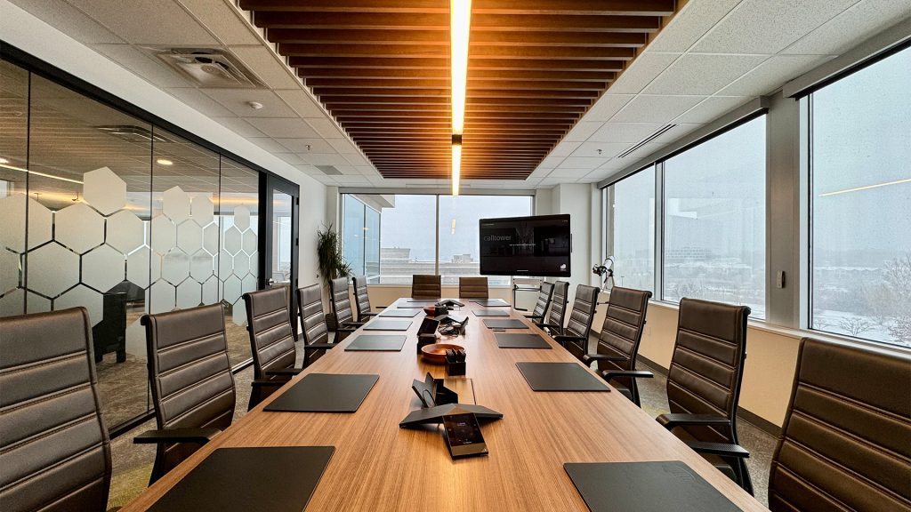 meeting room with large table and screen