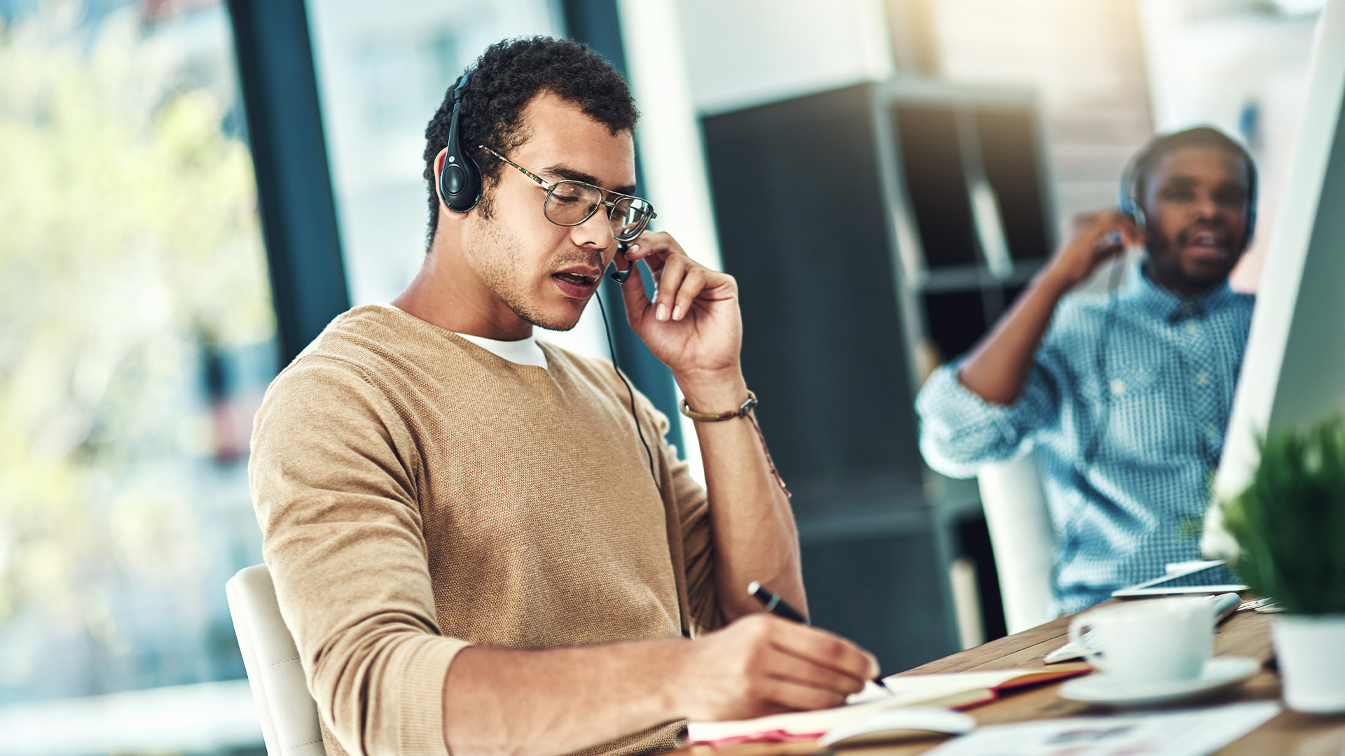 Telemarketing, business people and men with call center, help desk and customer service in office