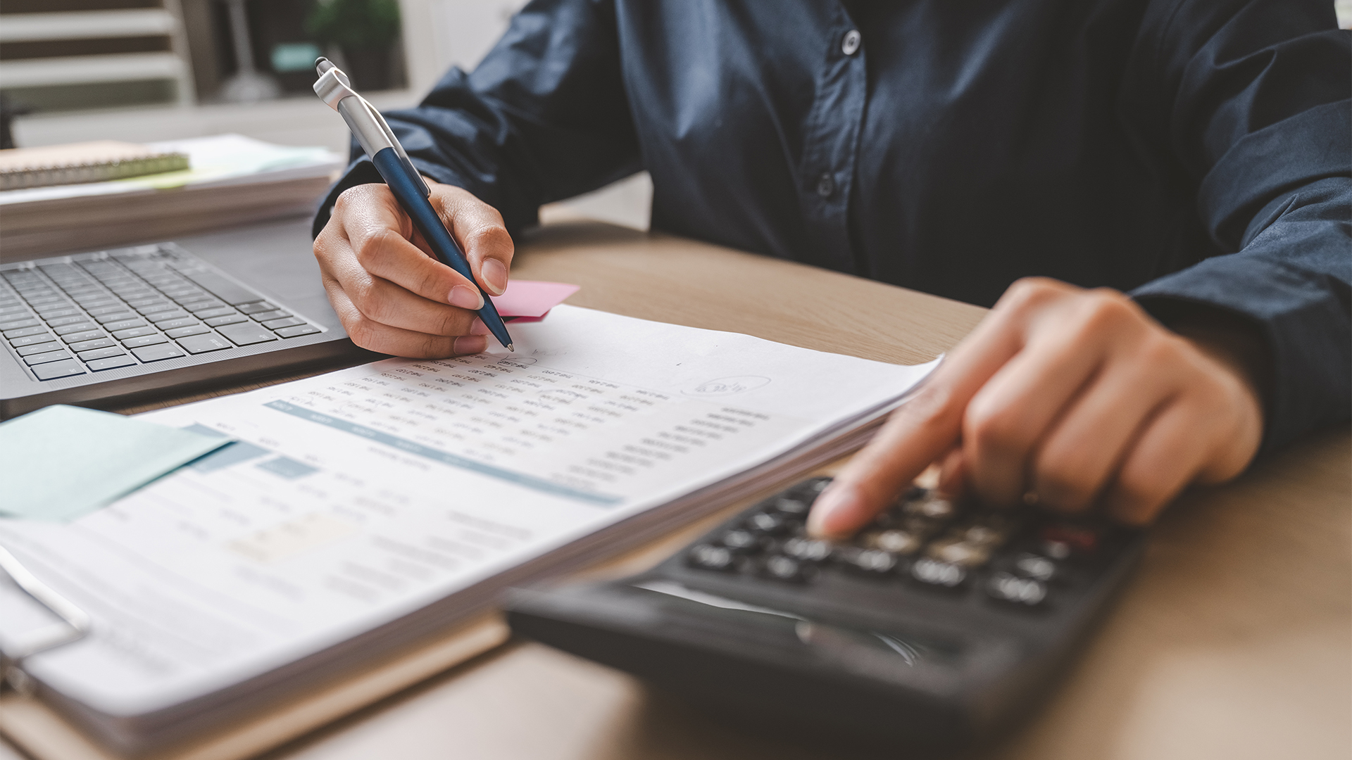 Accountant used a calculator financial analysis managing payroll tax accounting budget accounts.
