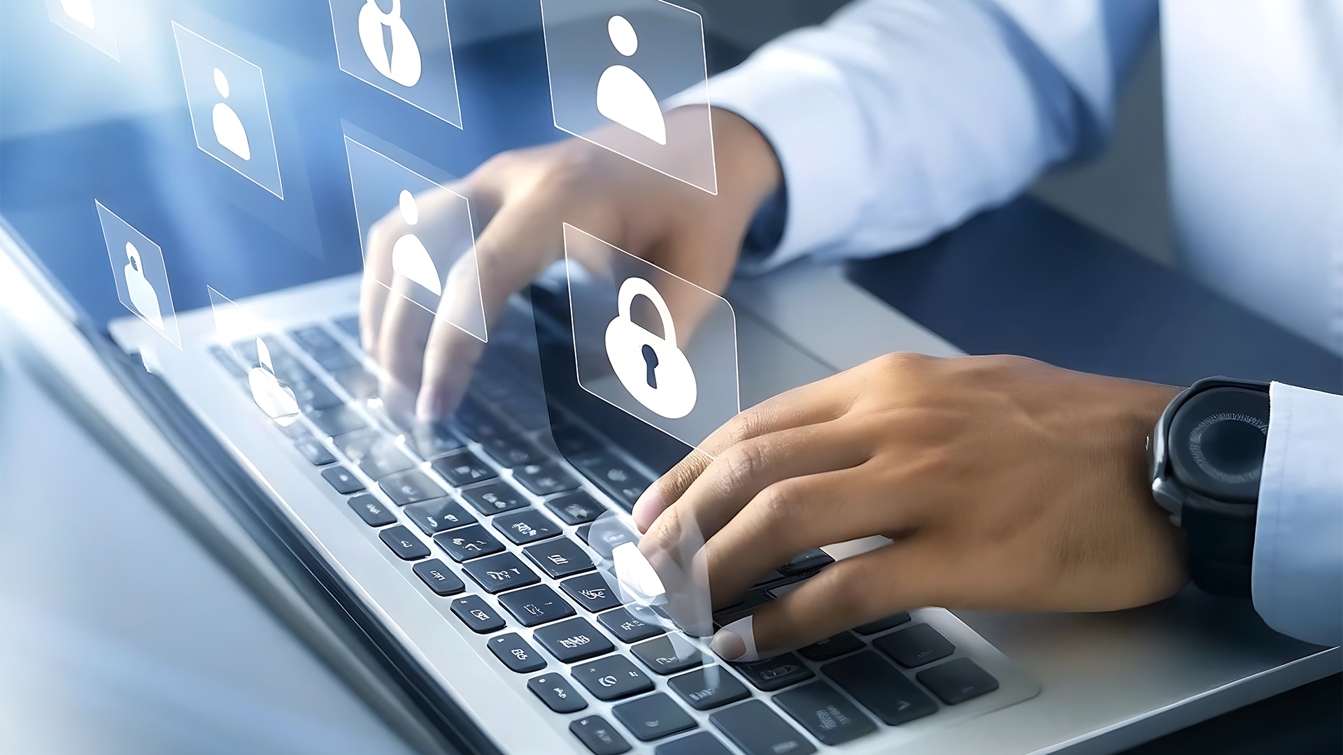 Hands Typing on Laptop with Security and User Icons Representing Data Protection and Privacy in Digital Communication