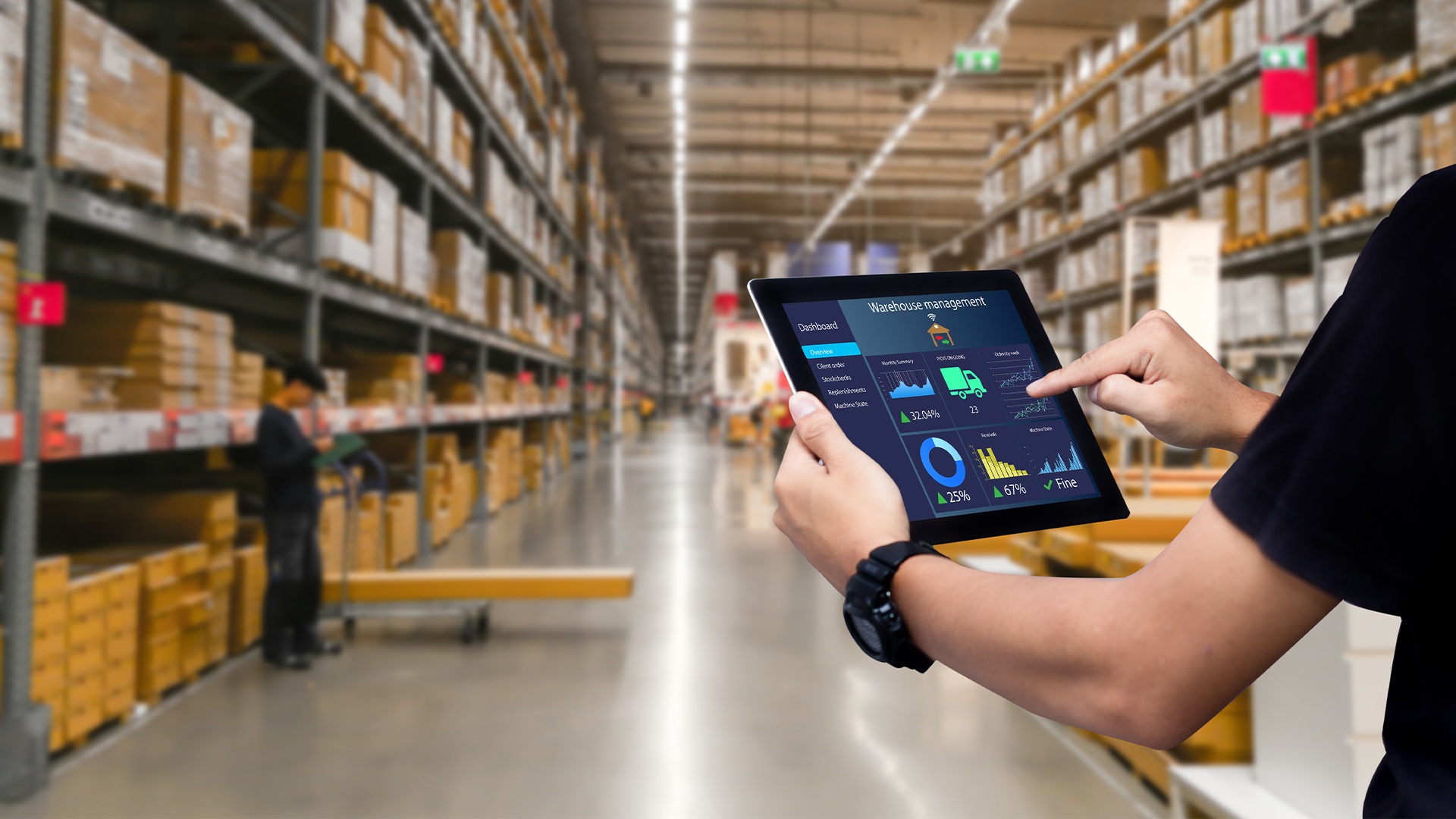 Smart warehouse management system.Worker hands holding tablet on blurred warehouse as background